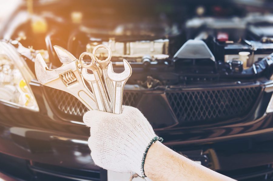 Mechanic with wrenches